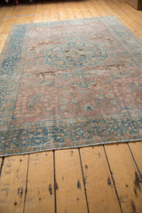 Distressed blush and ocean blue vintage Tabriz carpet with pictorial animal motifs.