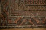 Secured sides and even wear across the knot heads of a vintage Persian Belouch carpet.