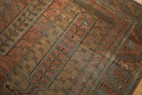 Detail of the paneled tree-of-life design and low-pile texture on a vintage Belouch rug.