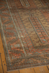 Low, even pile showing exposed knot heads on a distressed Persian Belouch carpet.