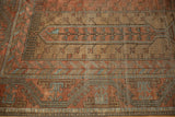 Even wear across the hand-knotted pile of a vintage Persian Belouch carpet.