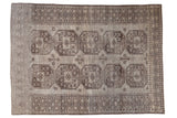Distressed vintage Ersari carpet with double column floral gul motifs in oxidized silver and charcoal.