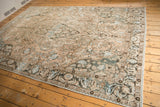 Distressed Baktiari rug corner, worn antique ivory, powder blue, dusty teal patterns.