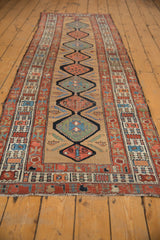 Antique Serab runner, interconnected medallions, Herati motifs, mallard green, red, sky blue, sand, natural wear.