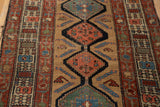 Antique Serab runner's intricate field design of medallions, botehs, and visible even wear.