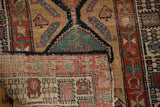Hand-knotted foundation visible on reverse of antique Serab rug runner with textured pile.
