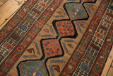 Antique Serab runner: worn sand field, alternating red, blue medallions, Herati motifs.