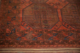 Vintage Ersari rug end: cherry red and navy geometric border, striped kilim, and fringe.