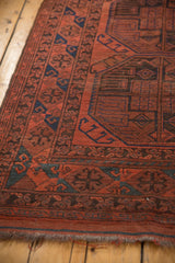 Vintage Ersari carpet edge, low pile with cherry red, navy geometric guls, and fringe.