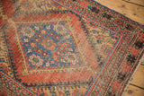 Intricate madder red and sky blue patterns on antique Mahal rug, revealing mostly even wear.