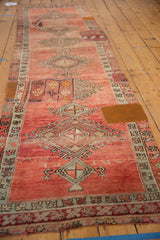 Blush and faded wine geometric medallion with fragmented kilim patchwork on vintage Oushak runner.