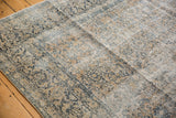 Worn pile of a distressed vintage Kashan carpet revealing foundation and faded floral vinery.