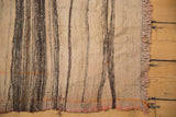 Distressed vintage Turkish Kilim rug with ivory, charcoal striped weave and fringed edge.
