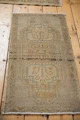 Distressed Oushak rug: faded tree of life, rams horn vinery in beige, seafoam green.
