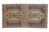 Distressed vintage Oushak rug runner, double medallions with pinwheel florals, faded aubergine and ivory.