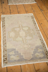 Distressed vintage Oushak rug detail with even pile wear and original side selvage.