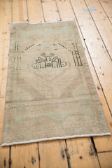 Distressed Oushak rug pile texture with even wear and subtle ivory, powder blue tones.