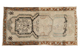 Distressed Oushak runner, triple medallion with vinery, heavy abrash, ivory and bronze.