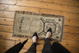 Soft abrash and muted triple medallion design on this decorative distressed Oushak rug.