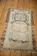Distressed Oushak runner with triple medallions, abrash, and even wear.