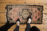 Distressed Oushak rug runner showcasing even wear to knot heads and softened blush tones.