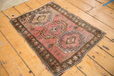 Distressed vintage Turkish Oushak rug with blush field, bronze triple gul, floral serpent designs.