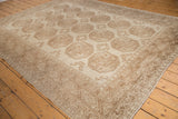 Distressed Ersari carpet, worn ivory and beige, featuring gul motifs and border pattern.