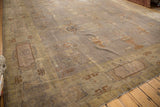 Distressed Indo Art Deco carpet corner with symbolic planter motifs and visible wear.