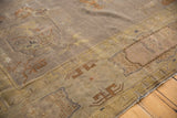 Faded mauve grey, pale gold Art Deco Indo carpet with distressed texture and motifs.