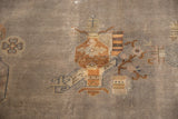 Vintage Art Deco carpet detail: bronze copper planter motif on faded mauve grey with wear to foundation.
