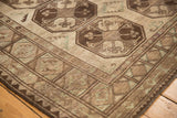 Distressed Ersari carpet corner, geometric border and gul motif in chocolate brown, ivory, green.