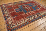 Antique Kazak rug prayer niche, sapphire blue, cherry red field, and wave motifs.