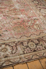 Distressed Mahal carpet border, worn texture exposing foundation, in blush, ivory, faded charcoal.