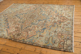 Distressed vintage Mehrivan corner with pale blue, apricot palmette vinery, faint foundation.
