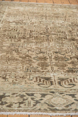 Distressed pile texture with faded geometric floral motifs and subtle turtle border.