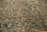 Distressed Mehrivan carpet border with classic turtle design, geometric ivory, teal field.
