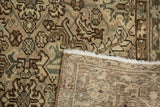Distressed pile texture with geometric patterns, showing faint foundation of Mehrivan rug.