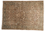 Distressed vintage Heriz rug, allover floral in faded earth tones, muted blue, ivory.