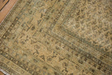 Distressed vintage Mir Sarouk, showing abrash, faded Mir Boteh, and worn pile.