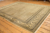 Distressed vintage Mir Sarouk corner with worn Mir Boteh design and faint foundation showing.