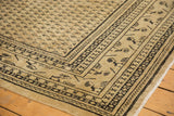 Distressed Mir Sarouk rug corner: Mir Boteh field, navy border motifs, and mostly even wear.