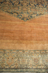 Distressed antique Persian Bibikabad rug pile showing pale copper field abrashes and intricate floral border.