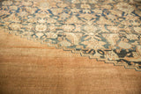 Antique distressed Bibikabad carpet with low pile, navy and beige Herati motif.