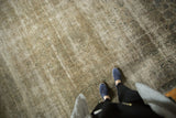 Time-softened tones and faded allover vinery on a distressed vintage Sivas carpet.