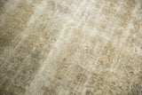 Distressed Sivas carpet with worn pile, antique ivory, and time-softened silver floral patterns.