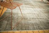 Distressed vintage Sivas rug, showcasing its worn texture and blended neutral colors.