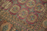 Intricate geometric gul motifs and border detail on an antique Turkmen carpet with mostly even wear.
