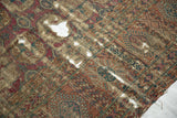 Detailed view of antique Turkmen carpet, showing extensive pile loss and exposed foundation.