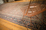 Antique Karabagh carpet with low pile, navy blue Mahi Mahi border, pale raspberry plum Herati field.