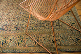 Antique Persian Khorassan border with Mahi Mahi and turtle design, softened navy and beige tones.